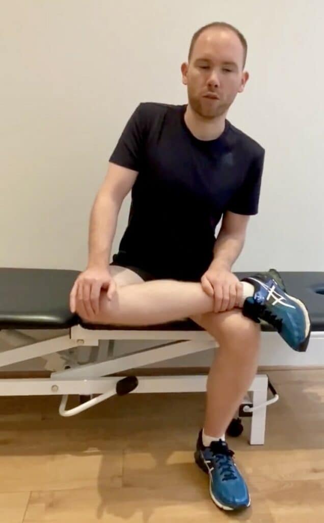 James McCormack doing a seated Glute Stretch