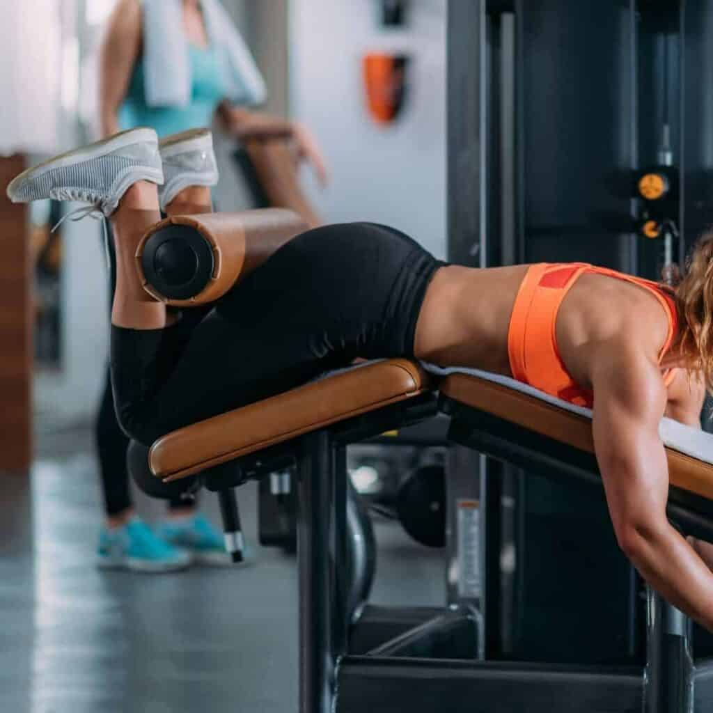 Image of a person using a Prone Hamstring Curl Machine
