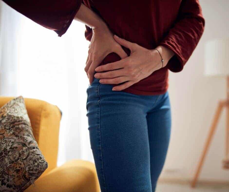 Picture of a person holding a painful hip