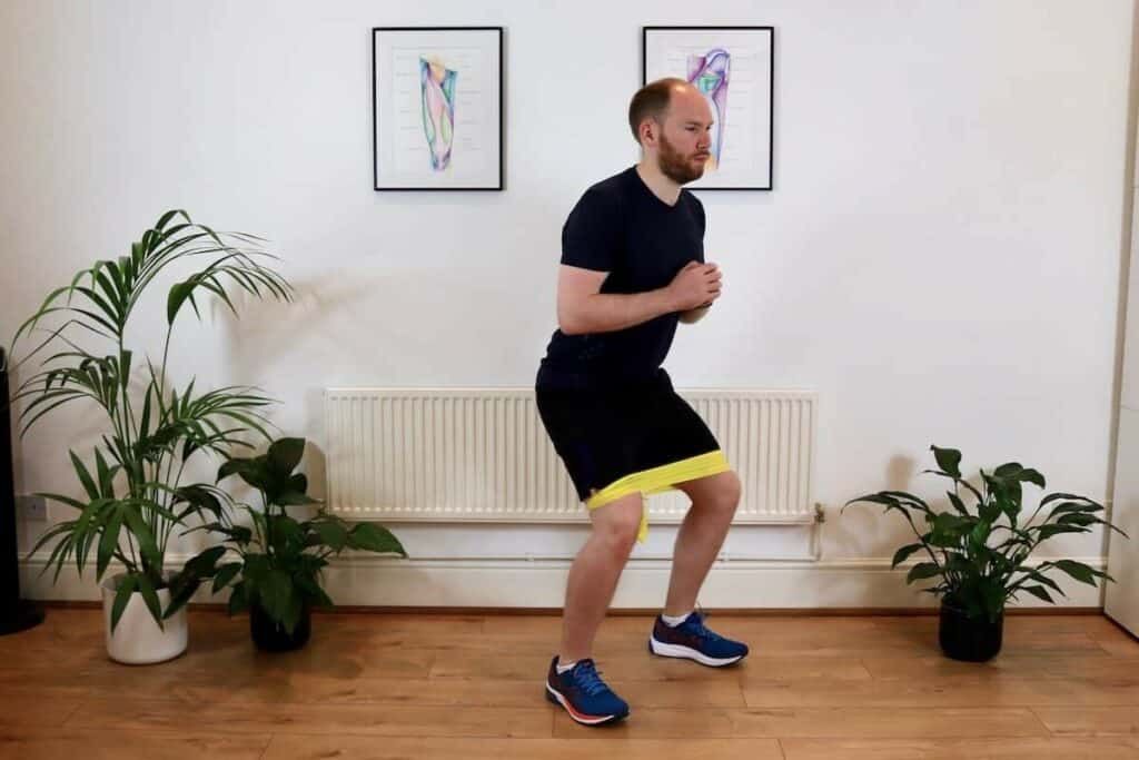 Picture of James McCormack doing a resisted side step exercise